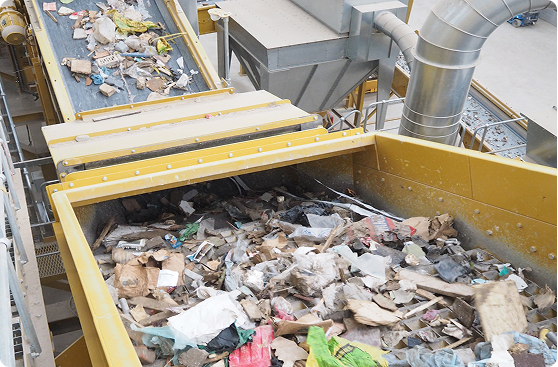 Recycling plant with a conveyor belt full of mixed waste, Sample Title Part One