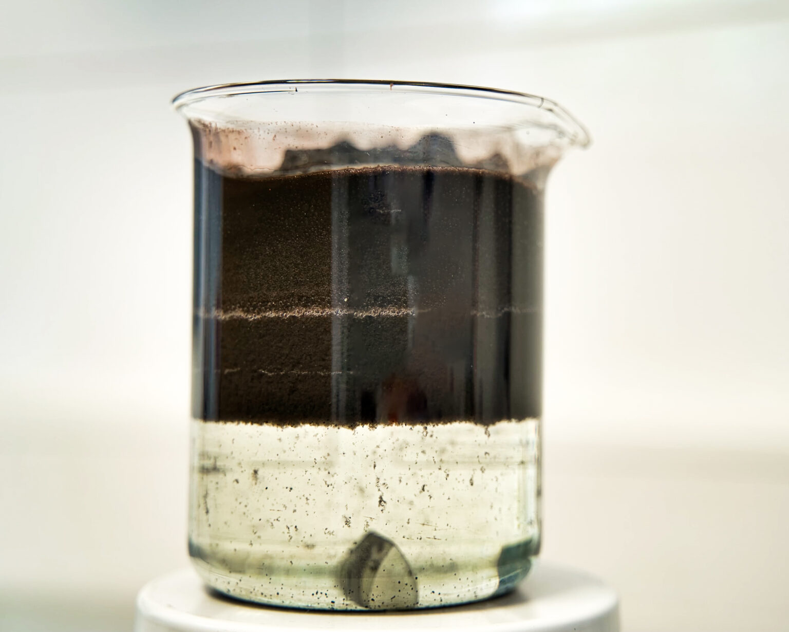A wastewater sample from the paper and pulp industry in which contaminants settle slowly