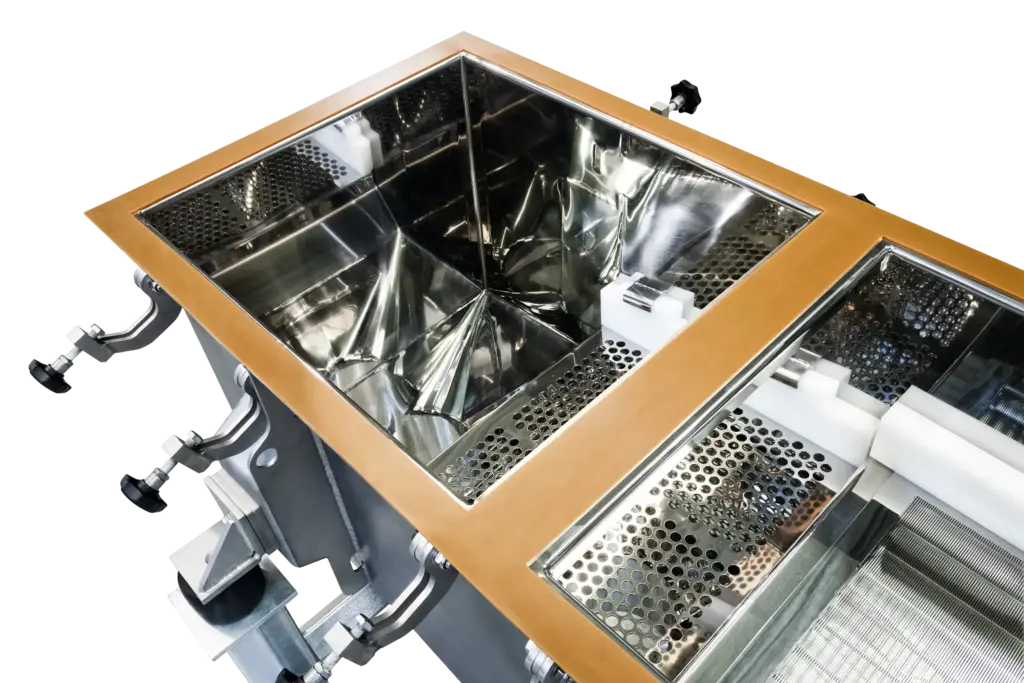 Stainless steel industrial equipment for metalworking with mesh elements.