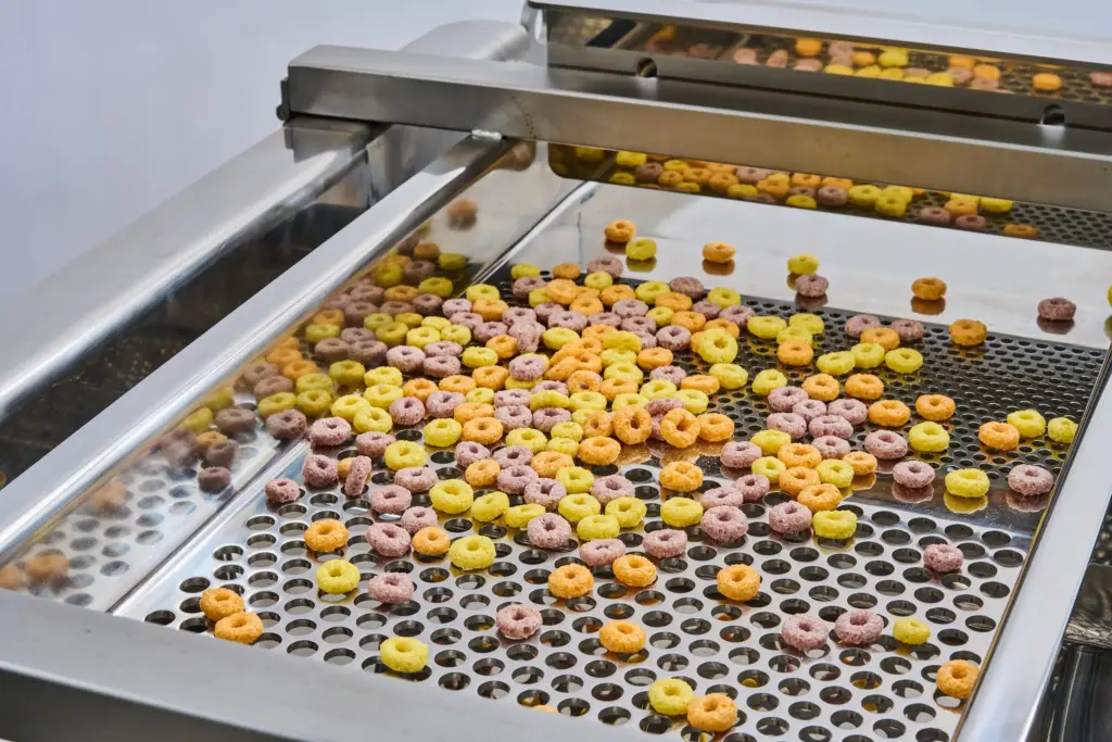 Close-up photo of the sieve deck of a food sifter