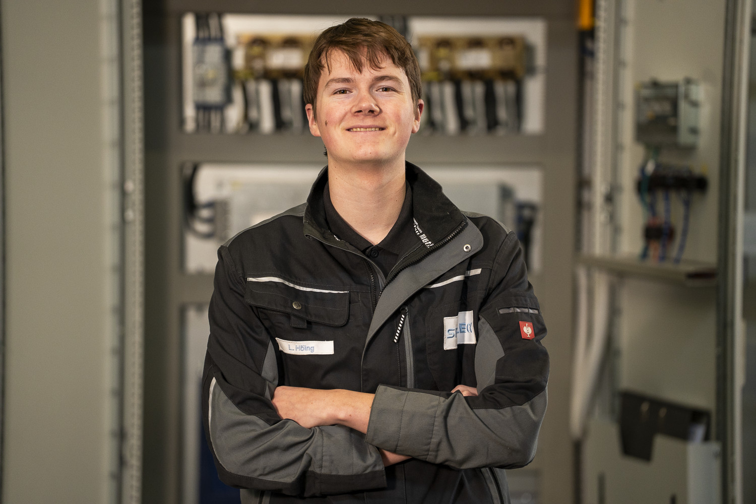 Spaleck, a mechatronics technician apprentice, smiles confidently at the camera