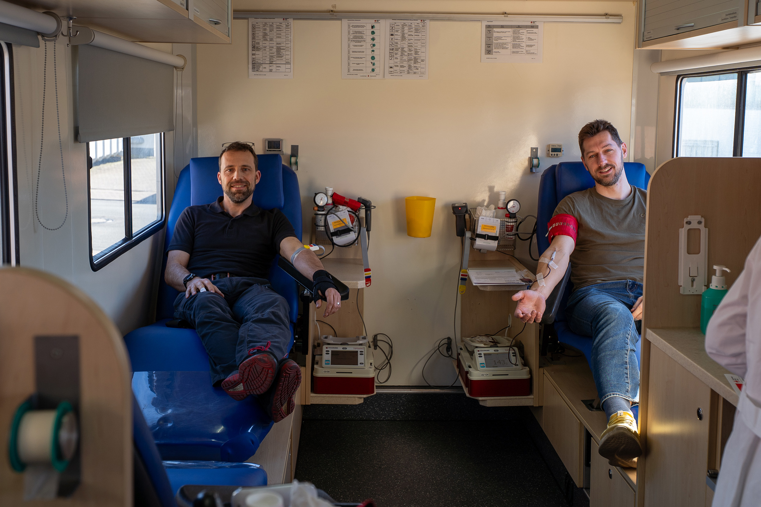 Two Spaleck employees donate blood at the German Red Cross (DRK) bloodmobile during Spaleck's Blood Donation Day