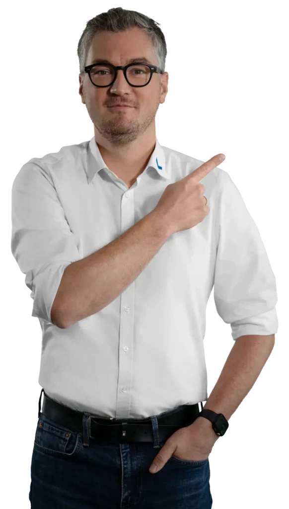 A man in a white shirt is pointing to the side; he is the contact person.