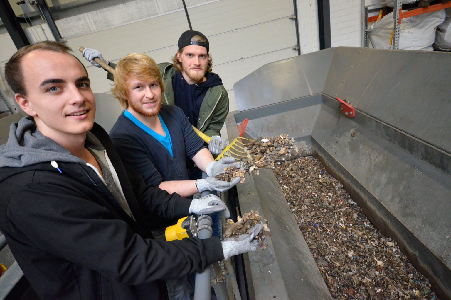 Three students working on a bionics project focused on recycling