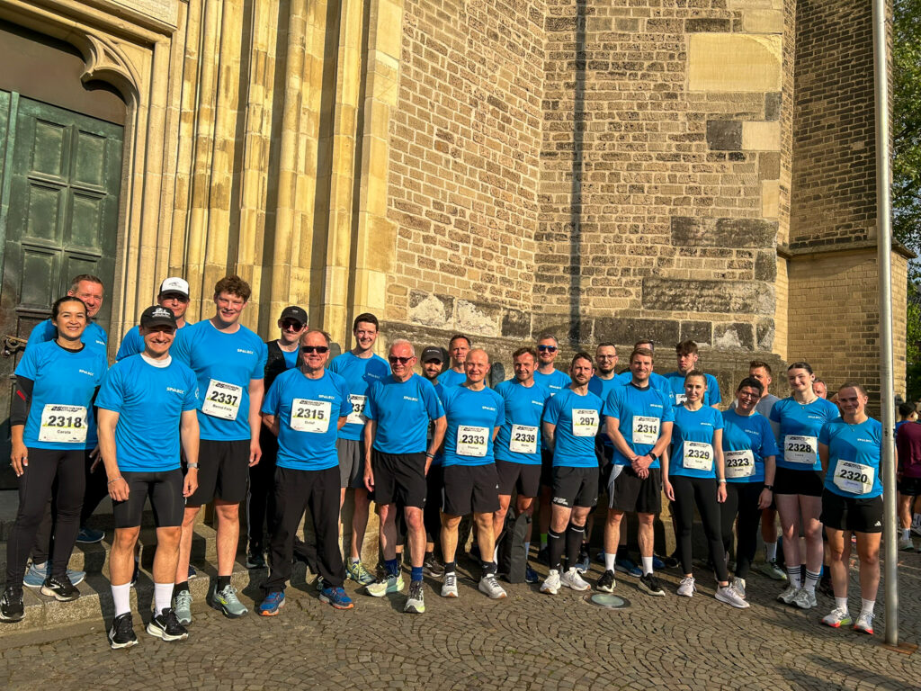 Group photo of the Spaleck team at the 2026 Bocholt City Run wearing their new blue SPALECK jerseys